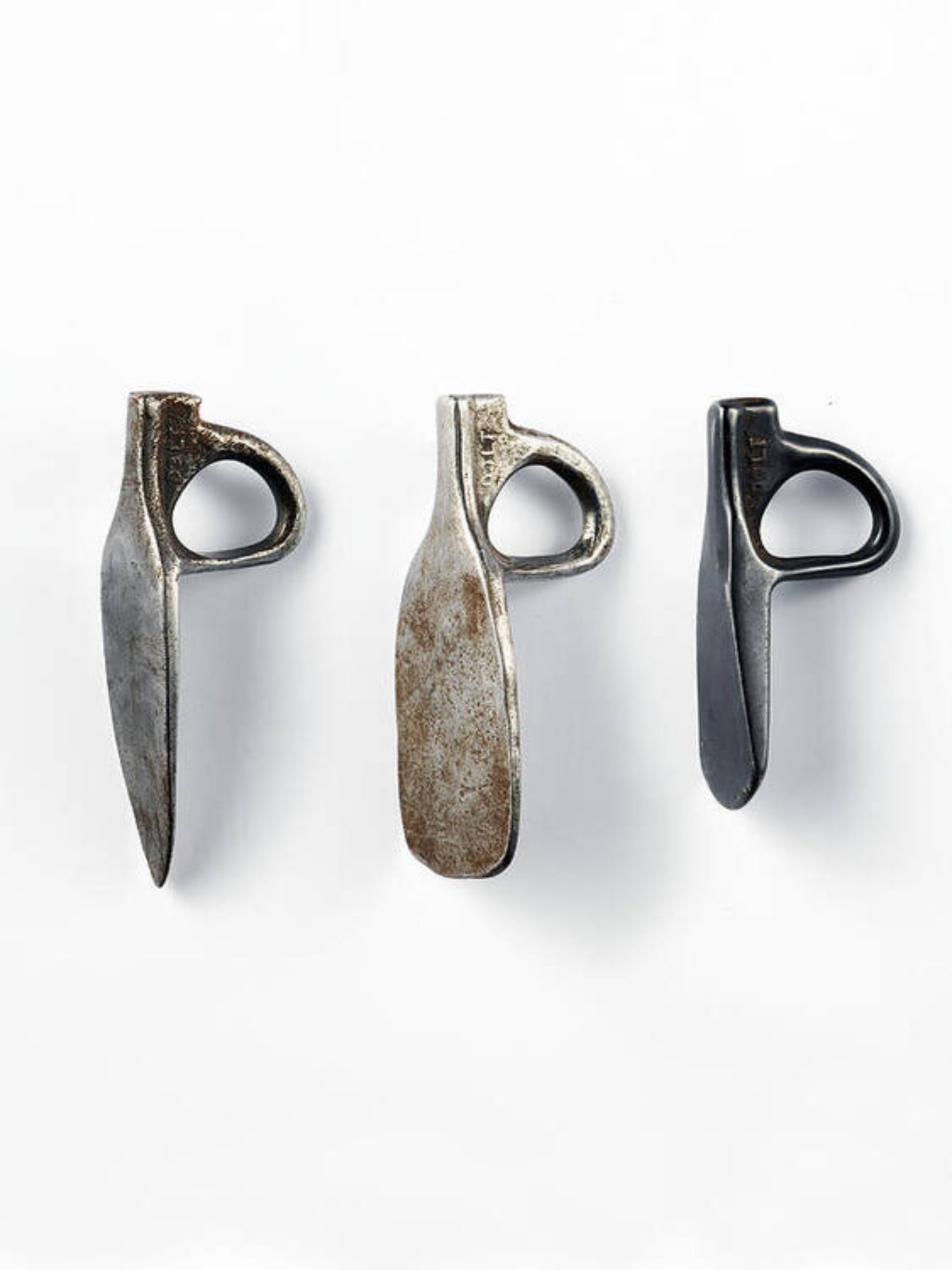 A set of three metal arrowhead-shaped objects with a white border against a white background, likely a part of the Dolt Arrows 2 art collection.