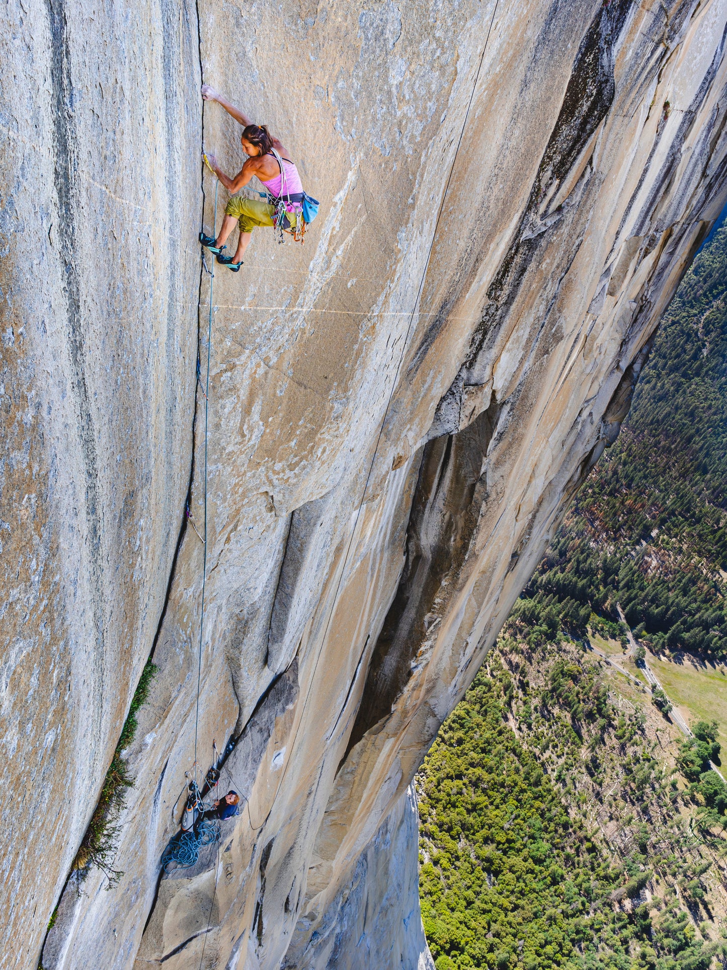 A photo print featuring a person climbing on a rock face with a scenic background.