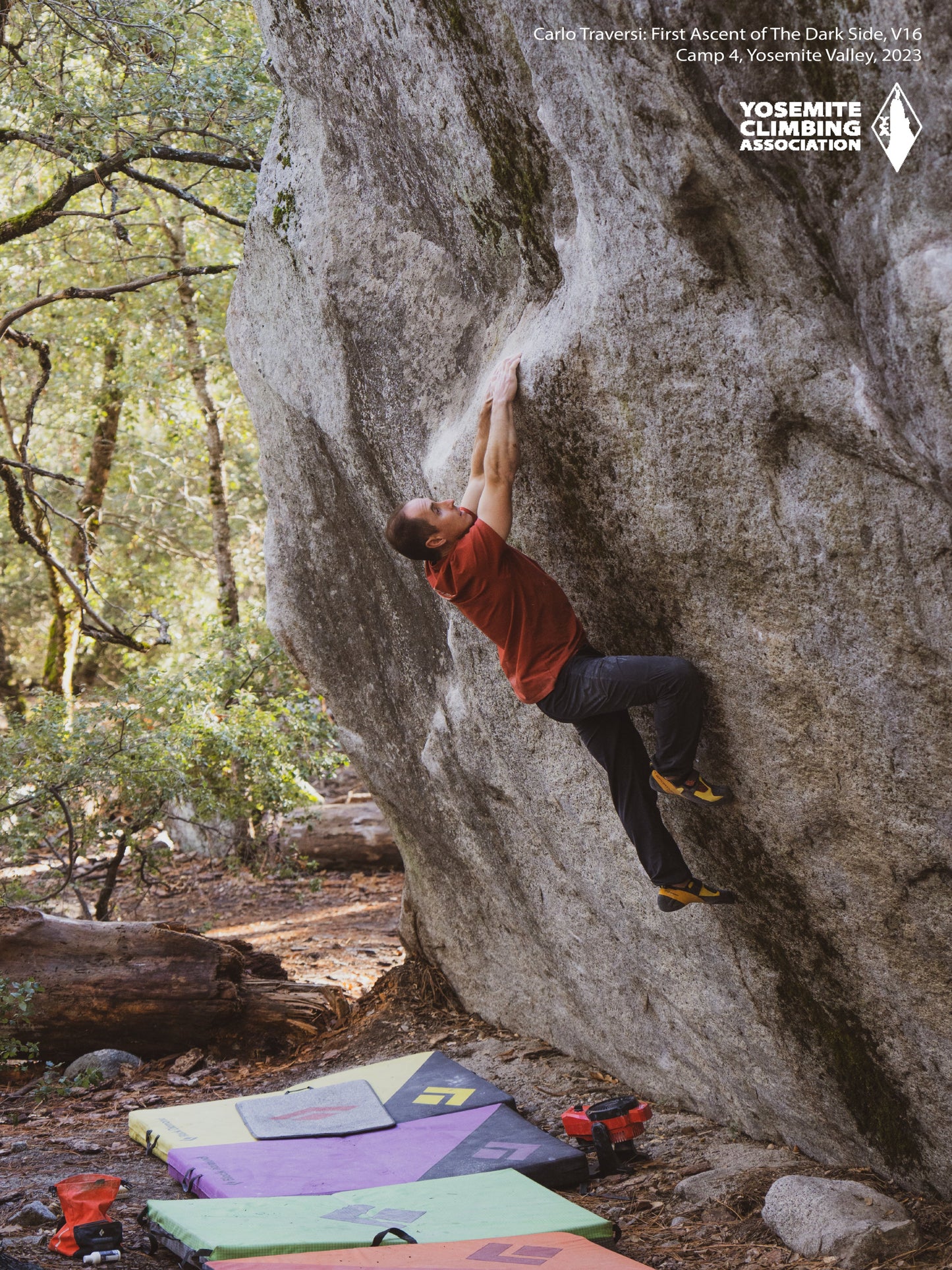 A climbing poster featuring a person climbing a rock face, with trees and a climbing hold visible. The background includes a colorful climbing mat and a backpack.