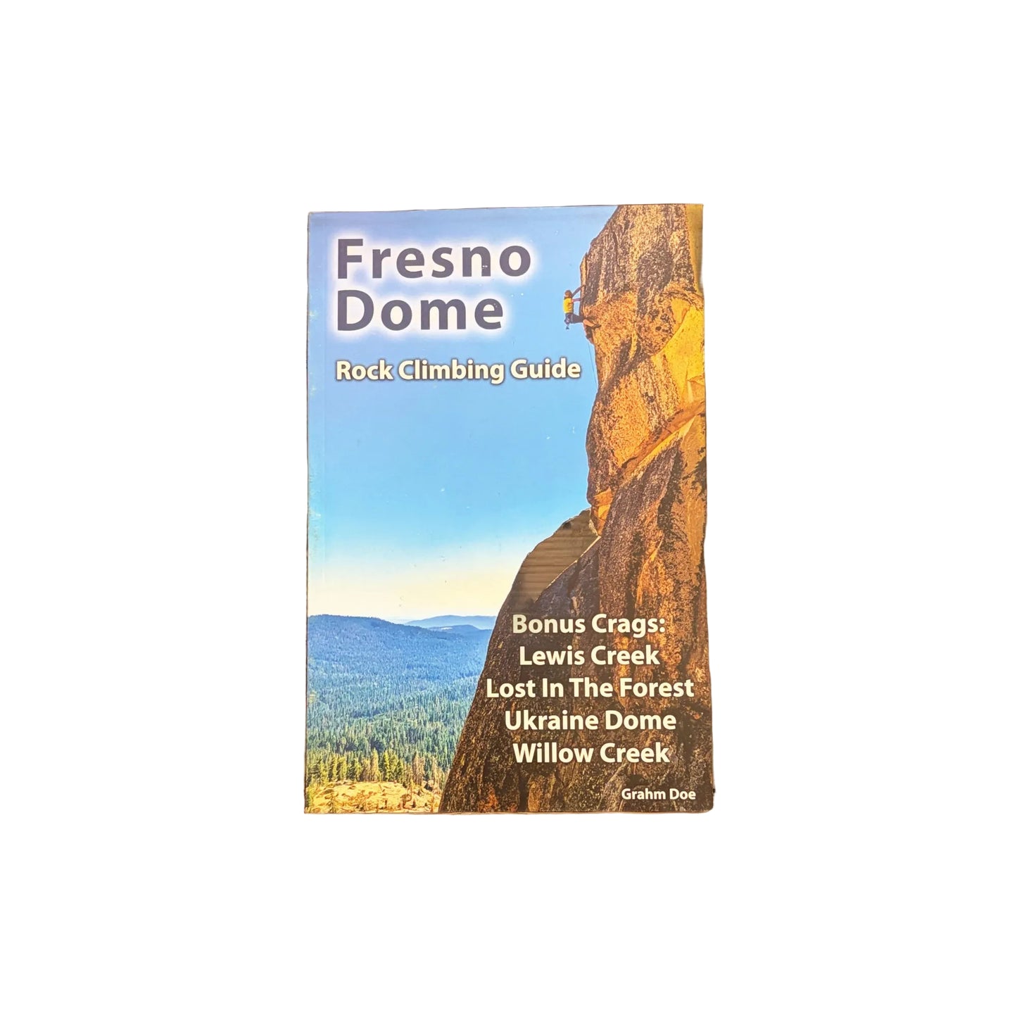 Fresno Dome rock climbing guidebook on a wooden surface